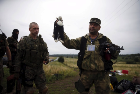 Pro Russian terrorists savaging the crash site of flight #MH17, which was shot down by a Russian BUK missile in July 2014 (source: Bellingcat and Bild Newspaper) https://www.bellingcat.com/?s=mh17